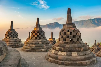 Wake up to borobudur’s ancient stones, ride a jeep near merapi volcano, and wander prambanan’s temples—all in one yogyakarta day tour with tickets and pickup.