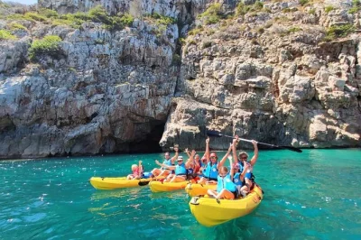 Paddle from denia to cova tallada by kayak, snorkel in the marine reserve, and explore the cave with a local guide—gear, photos, and insurance included.