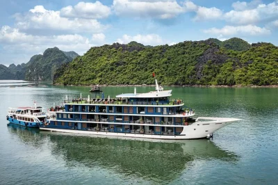 Wake up to limestone cliffs in lan ha bay, kayak hidden coves, cycle through viet hai village, and share sunset snacks on a 5-star cruise—includes pickup from hanoi.