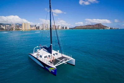 Feel the breeze on an oahu catamaran cruise from waikiki, spot honolulu’s skyline, enjoy drinks on deck, and relax with a local crew. includes pickup option.