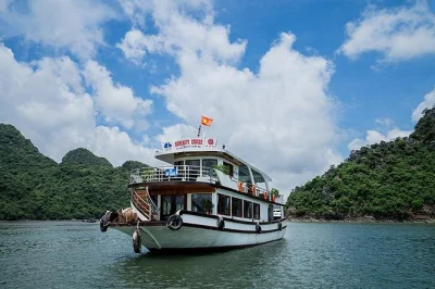 Feel the breeze on a halong bay day trip from hanoi, with kayaking, titop island hike or swim, cave walk, and seafood lunch. includes hotel pickup and sunset fruit party.