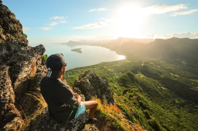 Feel the first light on le morne brabant with a sunrise hike and climb, guided by a local mountaineer. includes snacks, photo coverage, and expert safety support.