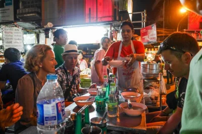 Follow a local guide through bangkok’s chinatown for a night of street food tastings, secret stories, and lively markets—includes all food and small group walk.