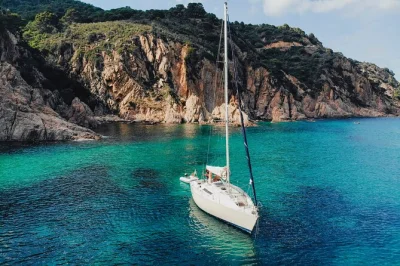 Sail ibiza and formentera on a private boat, swim in secret coves, snorkel espalmador, paddleboard at ses illetes, with flexible lunch options and local guides.