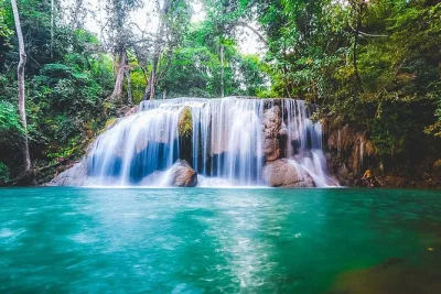 Swim at erawan falls, walk the historic death railway, and meet rescued elephants on a private kanchanaburi day trip with lunch and all entry fees included.