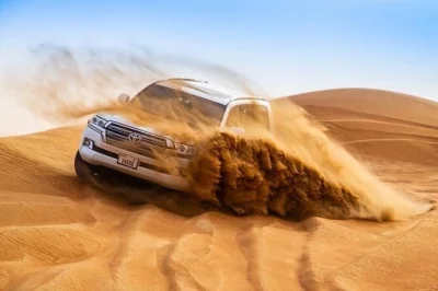Feel the rush of dubai’s lahbab red dunes, try sandboarding, share a bbq dinner under the stars with live shows. includes 4x4 pickup and local guide.