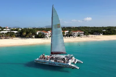 Sail from st maarten to prickly pear island on a catamaran, snorkel anguilla’s turquoise waters, enjoy caribbean buffet lunch onboard, and swim at mead’s bay—includes open bar and equipment.
