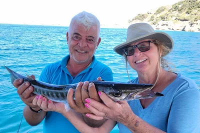 Step onto a wooden boat in rhodes, fish with locals skevos & michalis, grill your catch right onboard, and swim in the mediterranean. includes lunch & gear.