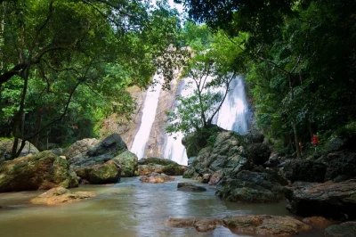 Feel the spirit of koh samui with temple visits, big buddha, grandmother & grandfather rocks, na muang waterfall and a thai lunch on the beach. includes pickup.