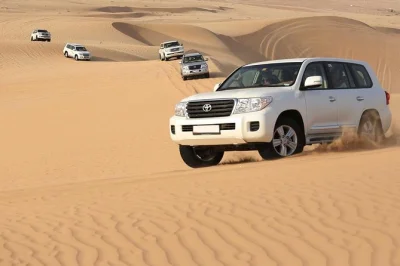 Feel the thrill of dubai’s lahbab red dunes with dune bashing, sandboarding, camel rides, and a bbq buffet dinner. includes pickup and live entertainment.