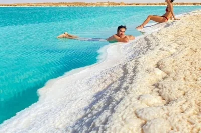 Feel the magic of siwa oasis with salt lake swims, oracle temple ruins, a 4x4 great sand sea safari, and sunset tea on fatnas island. includes pickup & meals.