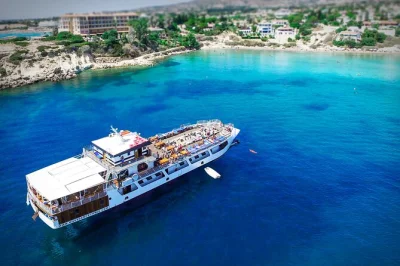Sun-soaked day cruise from paphos with swimming stops, live music, unlimited bar, and a cypriot lunch—all with hotel pickup and a local guide on board.