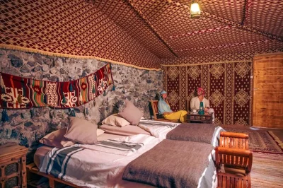 Sleep under dubai’s desert stars, ride a vintage land rover, watch falcons at sunset, and share emirati food by torchlight. includes hotel pickup & breakfast.