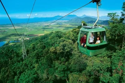 Float above rainforest on skyrail, ride the historic kuranda scenic railway, explore village markets, and see barron falls—includes cairns hotel pickup.