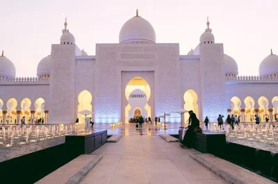 Feel the quiet inside sheikh zayed grand mosque, wander the louvre abu dhabi, see emirates palace & skyline views. includes pickup, tickets, and local guide.