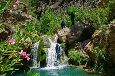 Feel the rush of canyoning in granada’s rio verde, sliding into turquoise pools with a small group and local guide. includes hotel pickup, equipment, and picnic lunch.