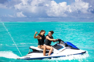 Wake up to bora bora’s lagoon on a jet ski tour circling mount otemanu, with swimming, a coconut husking show, and hotel pickup—guided fun for all levels.