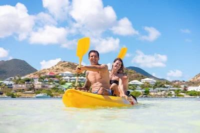 Feel the caribbean breeze as you kayak from st martin to pinel island, snorkel vibrant reefs, and relax on sandy beaches. includes kayak rental & reef tax.