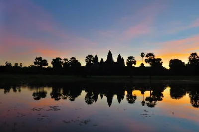 Watch sunrise at angkor wat, wander bayon’s stone faces, explore ta prohm’s tangled ruins, with early hotel pickup and a knowledgeable local guide included.