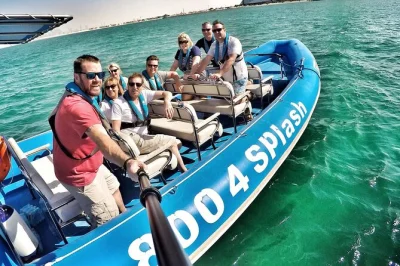 Feel the wind on a dubai speedboat tour from marina past burj al arab & atlantis, with photo stops, local guide, and flexible booking. includes bottled water.
