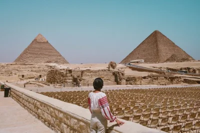 Feel the ancient stones of giza beneath your hands, ride a camel past the sphinx, and share koshary with locals—private tour includes hotel pickup and lunch.