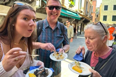 Follow a local through venice’s rialto market, taste cicchetti, and wander canal bridges on a small-group street food tour with guide and food tastings included.