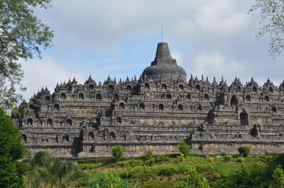Feel the cool stone under your hands at borobudur, trace ancient carvings at prambanan, and enjoy a private day trip from yogyakarta with all tickets and transport included.