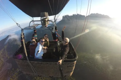 Float above montserrat near barcelona on a sunrise hot air balloon ride, guided by locals. includes early pickup, snack, champagne toast, and flight certificate.