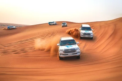 Feel the rush of dune bashing and sandboarding in abu dhabi’s desert, then meet camels and enjoy hotel pickup. small groups, local driver, water included.