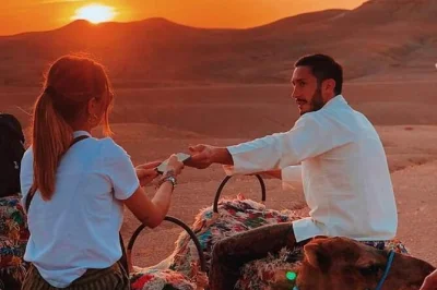 Book an agafay desert dinner with camel ride at sunset from marrakech. includes moroccan meal, mint tea, and live show. reserve your spot now.