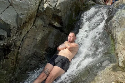 Feel the rush on el yunque’s natural waterslides, swim under waterfalls, and end with boricua food in luquillo. includes transport, photos, and local guide.