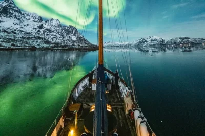 Step onto a cozy yacht in tromsø for a small-group northern lights cruise with hot tub, reindeer soup, and local crew. includes warm drinks and pickup options.