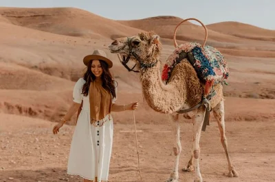 Experience a sunset camel ride in agafay desert, near marrakech. includes hotel pickup, moroccan mint tea in a berber tent, and private transport.