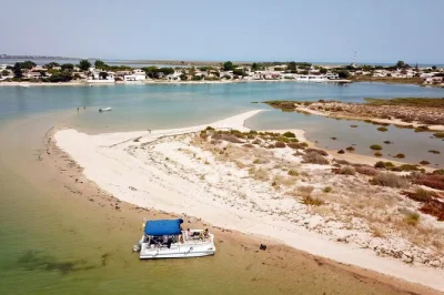 Feel the calm of ria formosa from olhão, walk white sand beaches, swim off a deserted island & visit culatra or farol village. includes skipper & two stops.