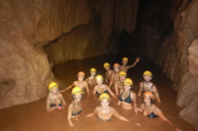 Feel the cool air of paradise cave, get muddy at dark cave, and zipline through jungle on this phong nha day trip. includes hotel pickup, gear, and vietnamese lunch.