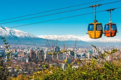 See santiago from above with a funicular ride up san cristobal hill, walk through bellavista’s colorful streets, and glide by cable car with a local guide—includes skip-the-line access and a taste