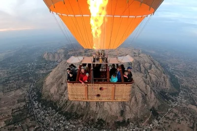 Float above jaipur’s villages, forts, and palaces at sunrise on a hot air balloon safari with tea, coffee, and local guide. includes pickup and all refreshments.