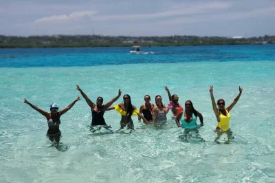 Feel the rhythm of san andres on a full-day marine tour with snorkeling, music, floating bars, and swim stops. includes drinks, music, and local guide.