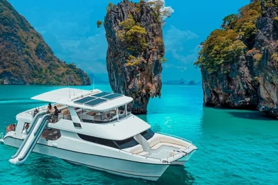 Set sail from phuket for james bond island, canoe at hong island, and float lanterns at sunset. includes hotel pickup, buffet lunch, and local guide.