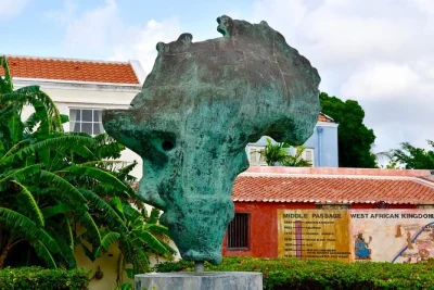 Step into curacao’s kurá hulanda museum—witness the transatlantic slave trade, west african empires, and ancient artifacts. includes entry & museum map.