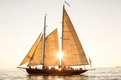 Feel the wind on a classic schooner yacht in salem, ma. sail past marblehead, explore local islands, and relax with drinks onboard. includes water and soft drinks.