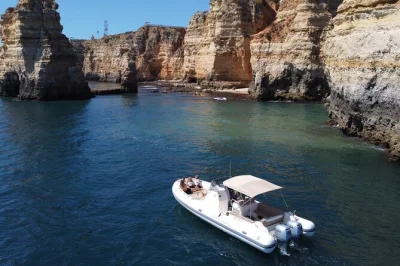 Feel the atlantic breeze on a private lagos boat tour to ponta da piedade, with secret caves, swimming stops, and a local skipper. includes bottled water and snorkel gear.