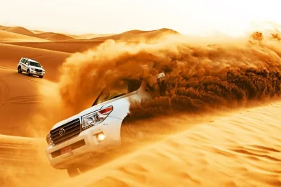 Feel the rush of dubai’s red dunes with quad biking, sandboarding, camel rides, live shows, and a camp bbq dinner. includes pickup and local guide.