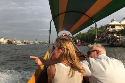 Step into bangkok’s heart with a private canal tour, vibrant flower market stroll, and temple visits—includes simple thai lunch and all entry fees.