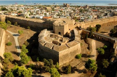 Step across cyprus’ border on a famagusta & salamis day trip from paphos, explore ancient ruins, medieval streets, and the haunting varosha ghost city, with hotel pickup included.