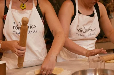 Step into a florence kitchen, roll fresh pasta, and churn gelato with a local chef. includes hands-on class, unlimited wine, and digital recipes to take home.