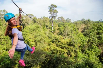 Feel the rush of ziplining above angkor wat’s jungle canopy in siem reap, crossing hanging bridges with expert guides. small groups, safety gear, and nature trek included.