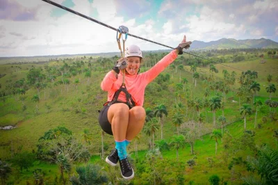 Feel the rush on 8 ziplines and a hanging bridge at hacienda tuko in punta cana, with hotel pickup, fruit bowl, and water included for your adventure.