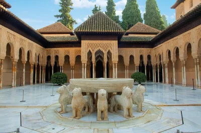 Step into granada’s alhambra with skip-the-line entry, explore the nasrid palaces, generalife gardens, and charles v palace, guided by a local expert. includes tickets.