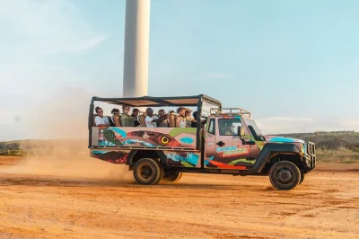 Feel the wild side of curaçao with a 4x4 safari through bandabou, explore ancient caves, visit savonet museum, and end with a swim—includes lunch & snorkel gear.